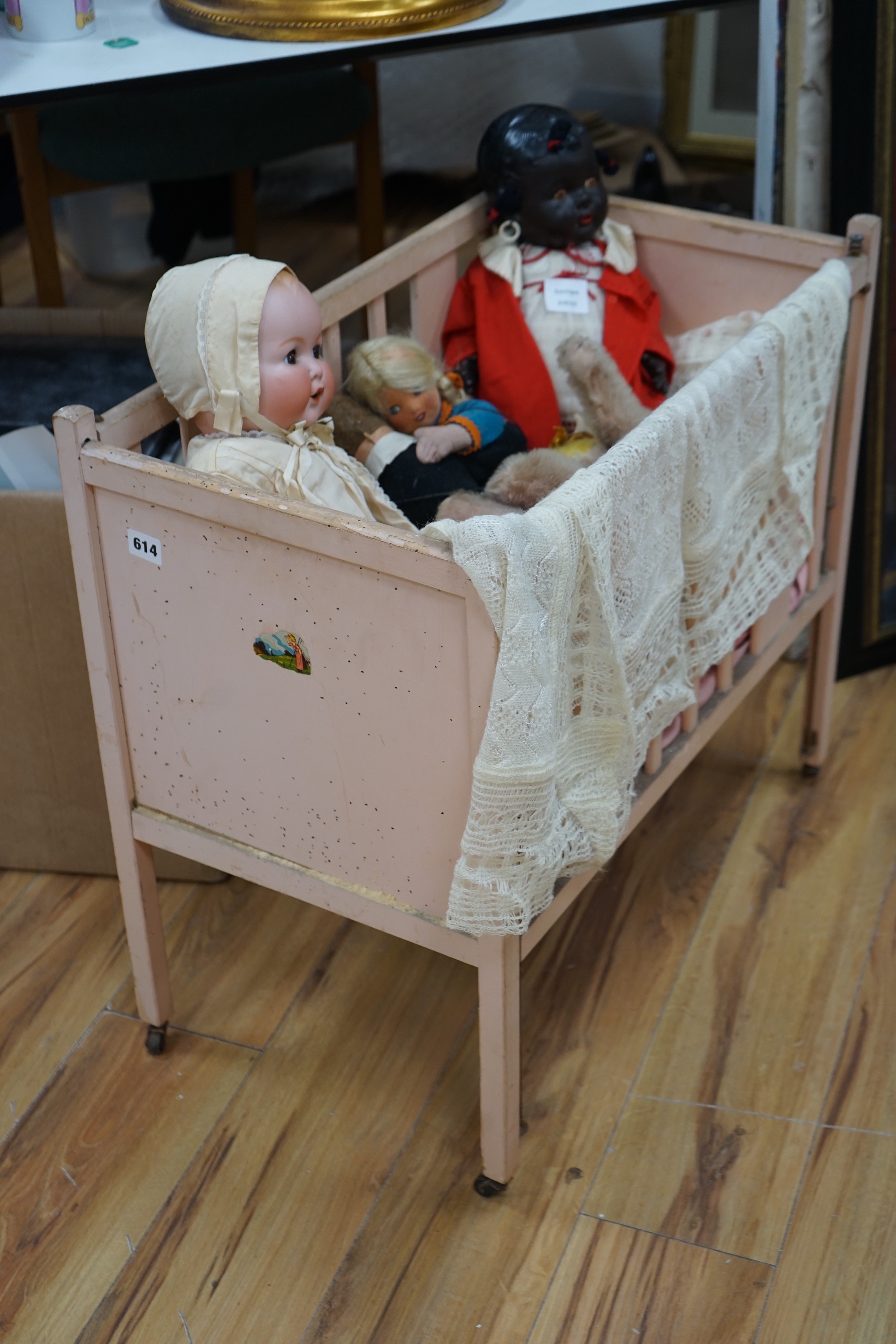An Armand Marseille bisque head baby doll, a black plastic doll and other dolls and toys